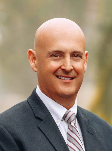 Dr. Christopher Berry smiling.